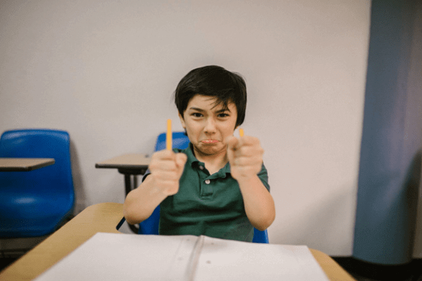 Hostile aggression: a boy broke a pencil