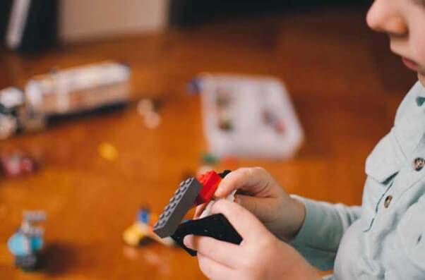 Little boy playing lego